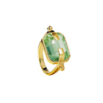 Ring with a light green crystal