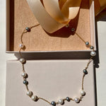 Necklace with cultured pearls